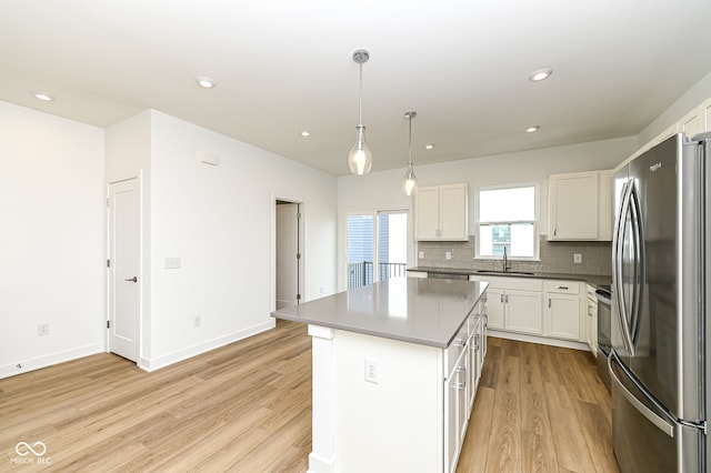 2416 Winthrop Ave, Indianapolis, IN 46205 - kitchen featuring stainless steel appliances, light wood-style floors, white cabinetry, and recessed lighting