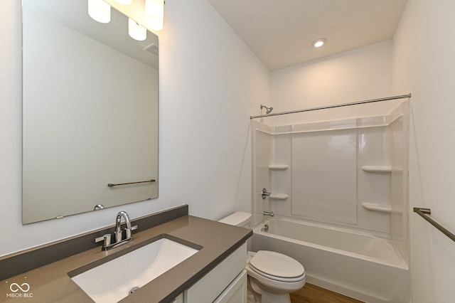 2416 Winthrop Ave, Indianapolis, IN 46205 - full bath with vanity, bathtub / shower combination, recessed lighting, and wood finished floors