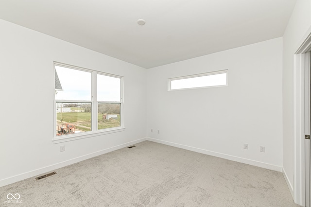 2416 Winthrop Ave, Indianapolis, IN 46205 - spare room featuring baseboards and carpet flooring