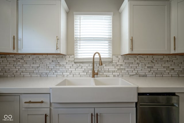 1409 Terrace Ave, Indianapolis, IN 46203 - kitchen with decorative backsplash, white cabinetry, and light countertops