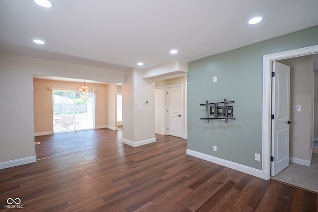 1409 Terrace Ave, Indianapolis, IN 46203 - empty room with dark wood-style flooring, a chandelier, and recessed lighting