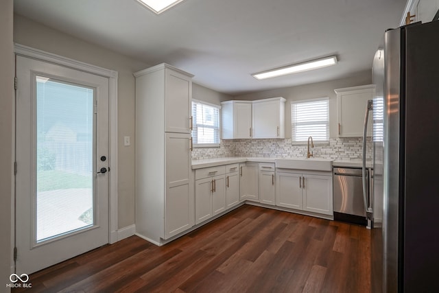 1409 Terrace Ave, Indianapolis, IN 46203 - kitchen featuring stainless steel appliances, plenty of natural light, and tasteful backsplash