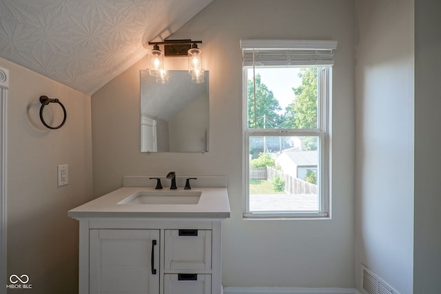 1409 Terrace Ave, Indianapolis, IN 46203 - bathroom featuring lofted ceiling and vanity