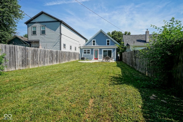 1409 Terrace Ave, Indianapolis, IN 46203 - back of property with a patio and a fenced backyard