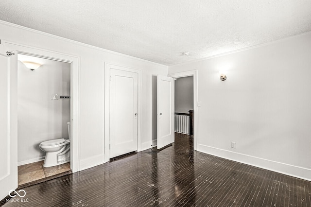 4123 N Illinois St, Indianapolis, IN 46208 - unfurnished bedroom featuring crown molding, a textured ceiling, wood finished floors, connected bathroom, and a closet