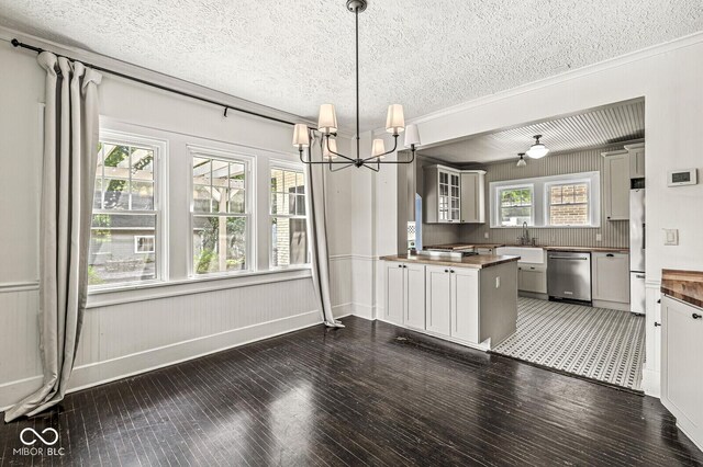 4123 N Illinois St, Indianapolis, IN 46208 - kitchen featuring stainless steel dishwasher, fridge, a textured ceiling, a chandelier, and wood-type flooring