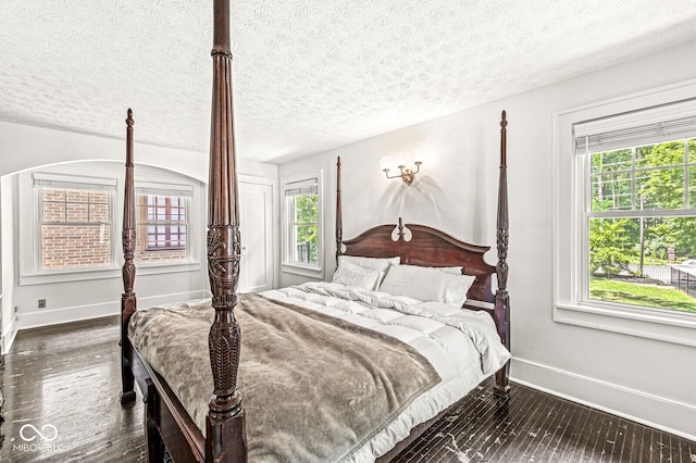4123 N Illinois St, Indianapolis, IN 46208 - bedroom with a textured ceiling and dark wood finished floors