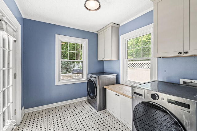 4123 N Illinois St, Indianapolis, IN 46208 - washroom with cabinet space, washing machine and dryer, plenty of natural light, and light floors