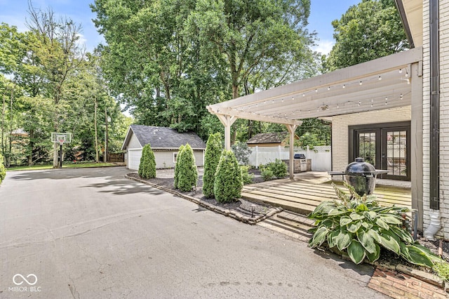 4123 N Illinois St, Indianapolis, IN 46208 - view of patio / terrace with french doors, an outbuilding, and a pergola
