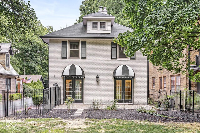 4123 N Illinois St, Indianapolis, IN 46208 - view of front facade featuring brick siding, a chimney, and roof with shingles