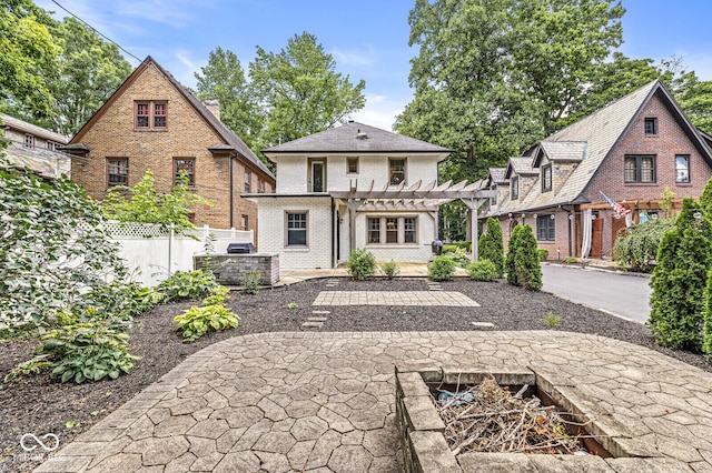 4123 N Illinois St, Indianapolis, IN 46208 - rear view of house featuring a pergola, brick siding, a patio, and driveway