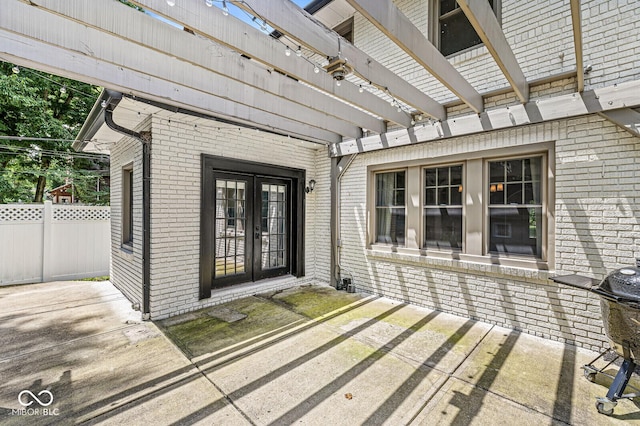 4123 N Illinois St, Indianapolis, IN 46208 - doorway to property featuring french doors, a pergola, and brick siding