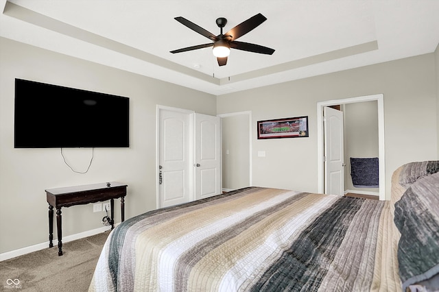 887 Tuxedo Dr, Westfield, IN 46074 - carpeted bedroom featuring a tray ceiling and a ceiling fan