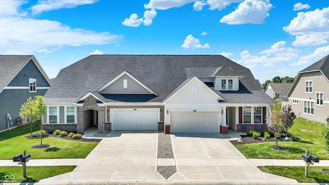 887 Tuxedo Dr, Westfield, IN 46074 - view of front facade featuring brick siding, concrete driveway, a front yard, a garage, and a shingled roof
