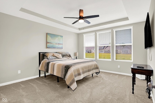 887 Tuxedo Dr, Westfield, IN 46074 - bedroom with a raised ceiling, light carpet, and a ceiling fan
