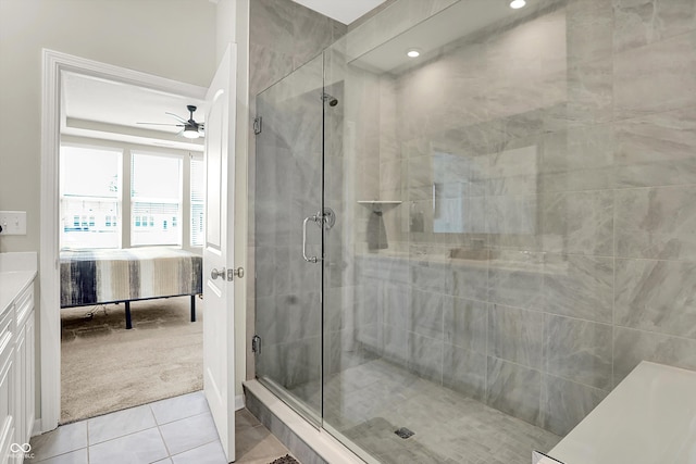 887 Tuxedo Dr, Westfield, IN 46074 - ensuite bathroom featuring tile patterned floors, a ceiling fan, a shower stall, and vanity