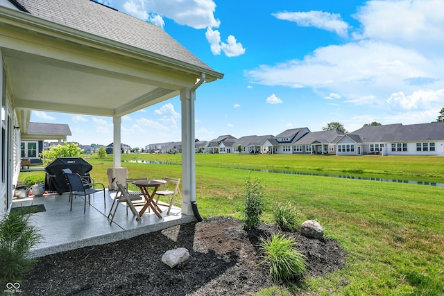 887 Tuxedo Dr, Westfield, IN 46074 - view of grassy yard with a patio area, a residential view, and a water view
