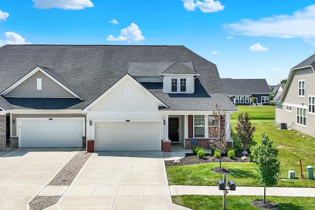 887 Tuxedo Dr, Westfield, IN 46074 - view of front facade with brick siding, concrete driveway, a porch, and a front yard