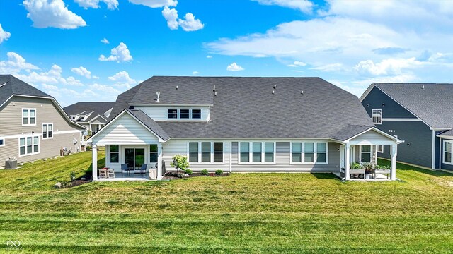 887 Tuxedo Dr, Westfield, IN 46074 - back of property featuring a patio area, a lawn, and roof with shingles