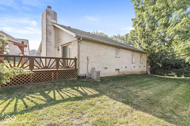 3772 Brill Rd, Indianapolis, IN 46227 - rear view of property with brick siding, a yard, a chimney, a deck, and crawl space