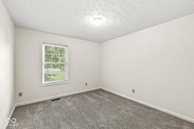3772 Brill Rd, Indianapolis, IN 46227 - spare room with carpet floors and a textured ceiling