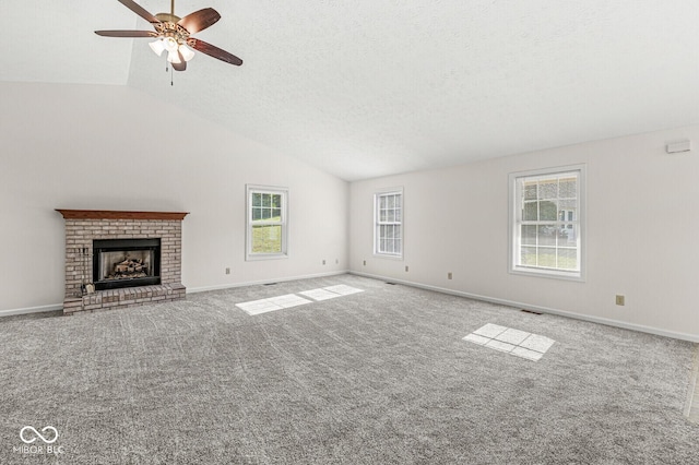 3772 Brill Rd, Indianapolis, IN 46227 - unfurnished living room featuring vaulted ceiling, ceiling fan, carpet floors, a fireplace, and a textured ceiling