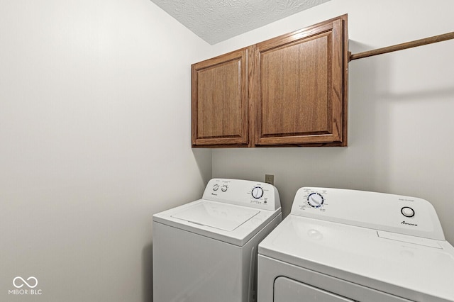 3772 Brill Rd, Indianapolis, IN 46227 - laundry room with separate washer and dryer, cabinet space, and a textured ceiling