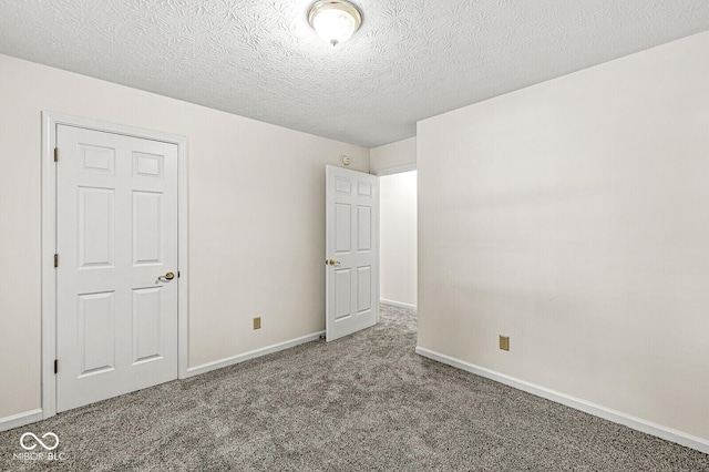 3772 Brill Rd, Indianapolis, IN 46227 - unfurnished bedroom featuring carpet and a textured ceiling