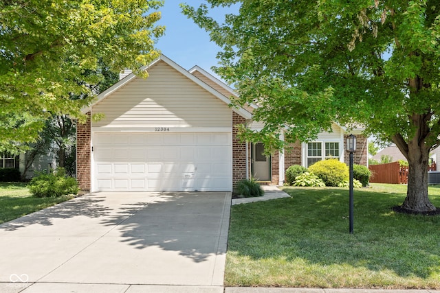 12384 Barnstone Ct, Fishers, IN 46037 - view of property hidden behind natural elements with brick siding, a garage, and concrete driveway