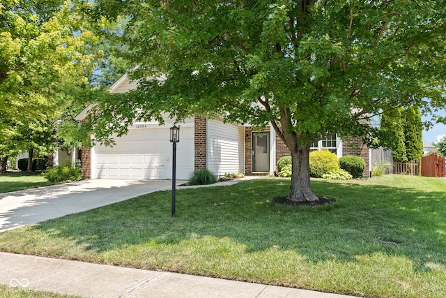 12384 Barnstone Ct, Fishers, IN 46037 - view of property hidden behind natural elements featuring brick siding, a garage, and driveway
