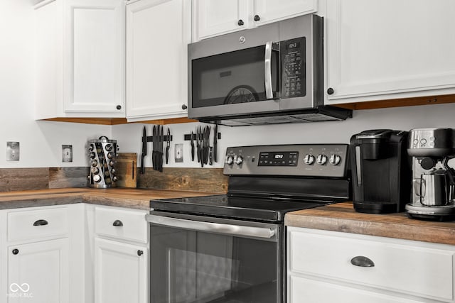 12384 Barnstone Ct, Fishers, IN 46037 - kitchen with appliances with stainless steel finishes, wooden counters, and white cabinets