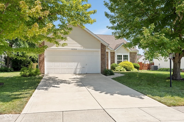 12384 Barnstone Ct, Fishers, IN 46037 - obstructed view of property featuring brick siding, a garage, driveway, and roof with shingles