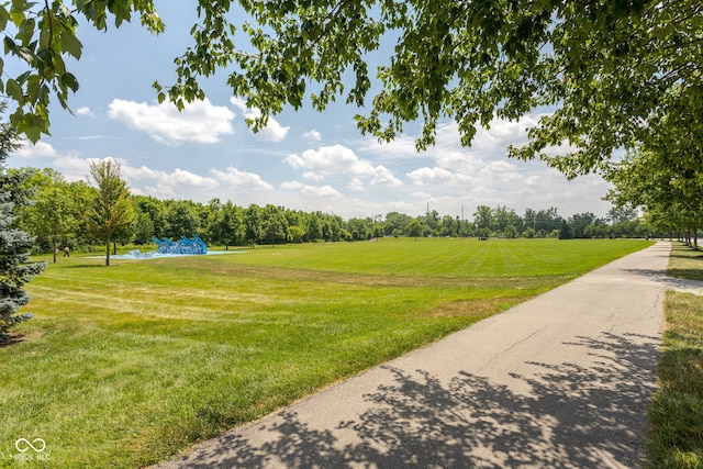 12384 Barnstone Ct, Fishers, IN 46037 - view of home's community featuring a yard and view of wooded area