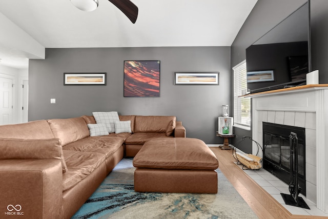 12384 Barnstone Ct, Fishers, IN 46037 - living area featuring a fireplace, a ceiling fan, and light wood-style flooring