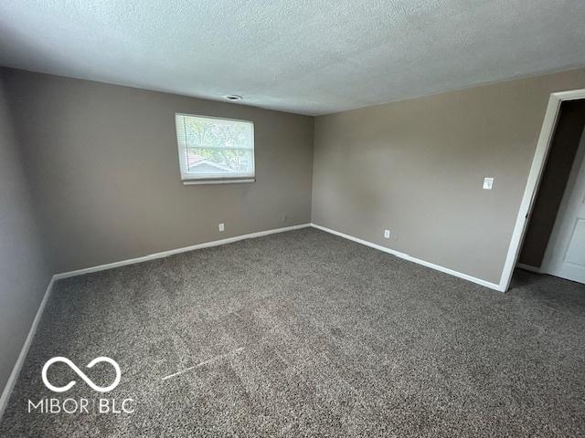2732 Morning Star Dr, Indianapolis, IN 46229 - carpeted empty room featuring a textured ceiling