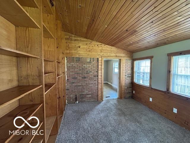 2732 Morning Star Dr, Indianapolis, IN 46229 - carpeted spare room with lofted ceiling, wooden walls, and wooden ceiling