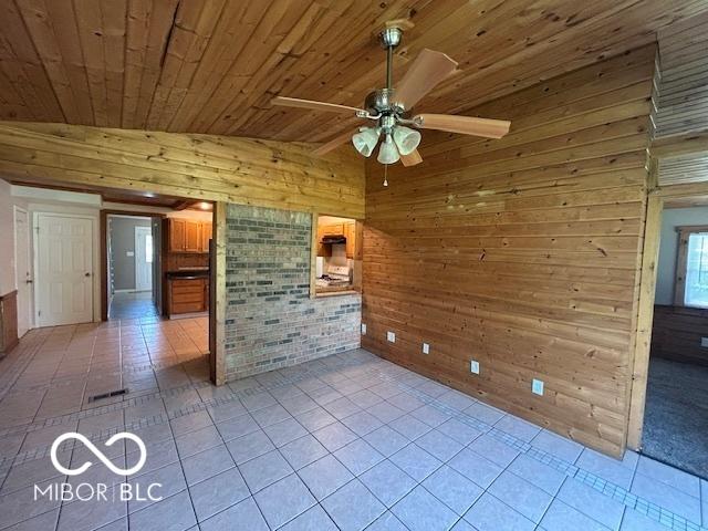 2732 Morning Star Dr, Indianapolis, IN 46229 - unfurnished room with wood walls, wooden ceiling, light tile patterned floors, a ceiling fan, and vaulted ceiling