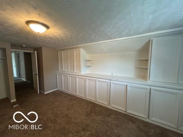 2732 Morning Star Dr, Indianapolis, IN 46229 - spare room with dark colored carpet and a textured ceiling