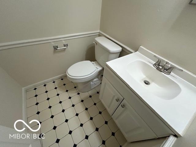 2732 Morning Star Dr, Indianapolis, IN 46229 - half bath with vanity and tile patterned floors