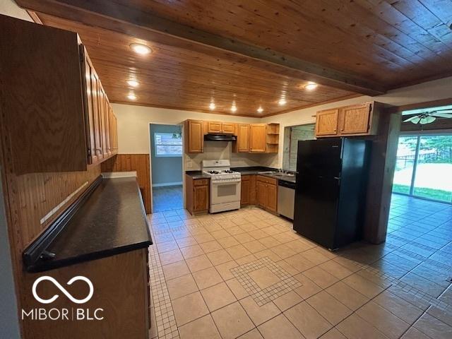 2732 Morning Star Dr, Indianapolis, IN 46229 - kitchen with white gas range, freestanding refrigerator, wood ceiling, under cabinet range hood, and stainless steel dishwasher