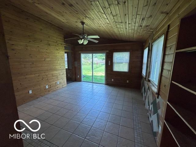 2732 Morning Star Dr, Indianapolis, IN 46229 - tiled empty room featuring wooden walls, a ceiling fan, lofted ceiling, and wooden ceiling