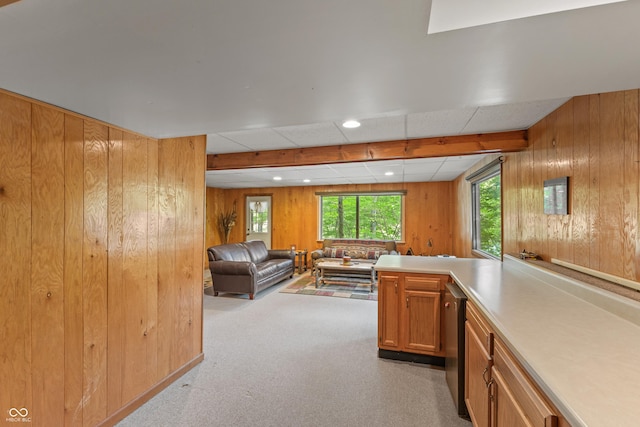 2591 S Glen Cv, Martinsville, IN 46151 - kitchen featuring wooden walls, plenty of natural light, open floor plan, carpet, and brown cabinets