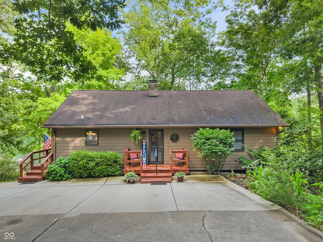 2591 S Glen Cv, Martinsville, IN 46151 - view of front of home with a chimney and roof with shingles