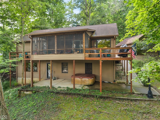 2591 S Glen Cv, Martinsville, IN 46151 - rear view of house featuring a sunroom, a patio, a hot tub, and a wooden deck
