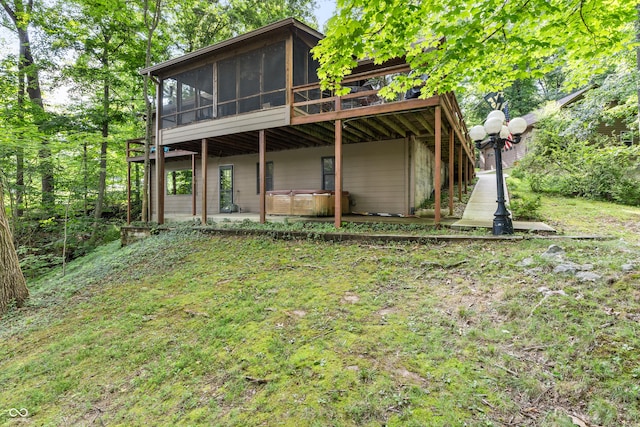 2591 S Glen Cv, Martinsville, IN 46151 - back of property with a jacuzzi, a sunroom, and a deck