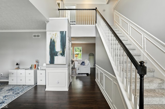 682 Shannon Ct, Noblesville, IN 46062 - foyer with ornamental molding, a decorative wall, stairs, hardwood / wood-style flooring, and wainscoting