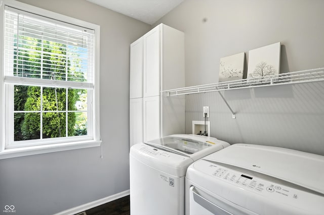 682 Shannon Ct, Noblesville, IN 46062 - laundry area with cabinet space, washing machine and clothes dryer, and dark wood-type flooring