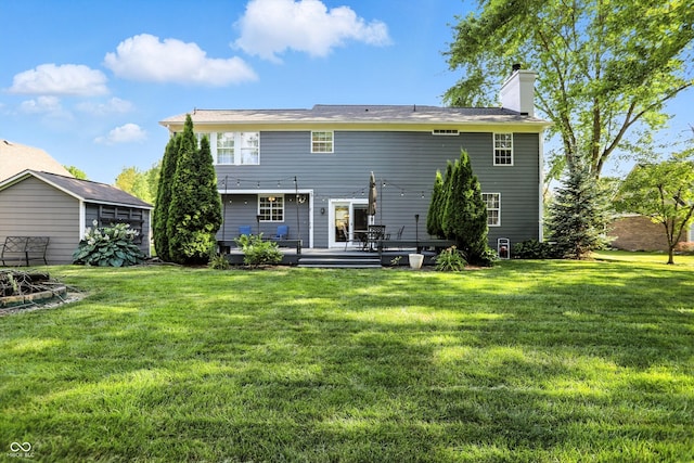 682 Shannon Ct, Noblesville, IN 46062 - back of house with a chimney, a yard, and a wooden deck
