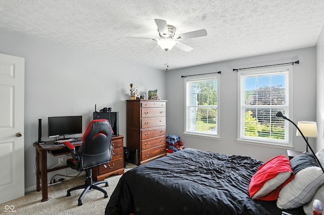 682 Shannon Ct, Noblesville, IN 46062 - bedroom featuring carpet, an office area, a textured ceiling, and a ceiling fan