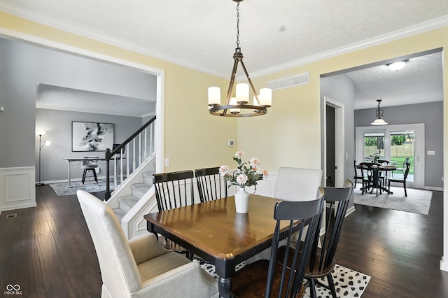 682 Shannon Ct, Noblesville, IN 46062 - dining space featuring dark wood-style floors, crown molding, and a chandelier